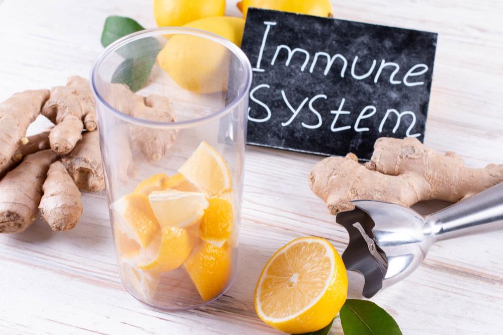 Group of foods that help immunity in winter, with a black sign saying 'immunity' written in white chalk.