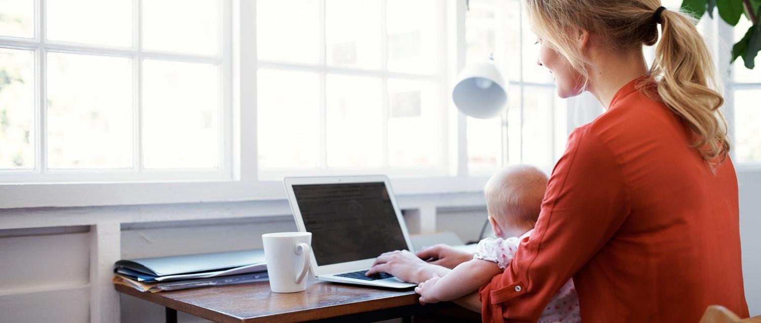 woman and child looking at computer